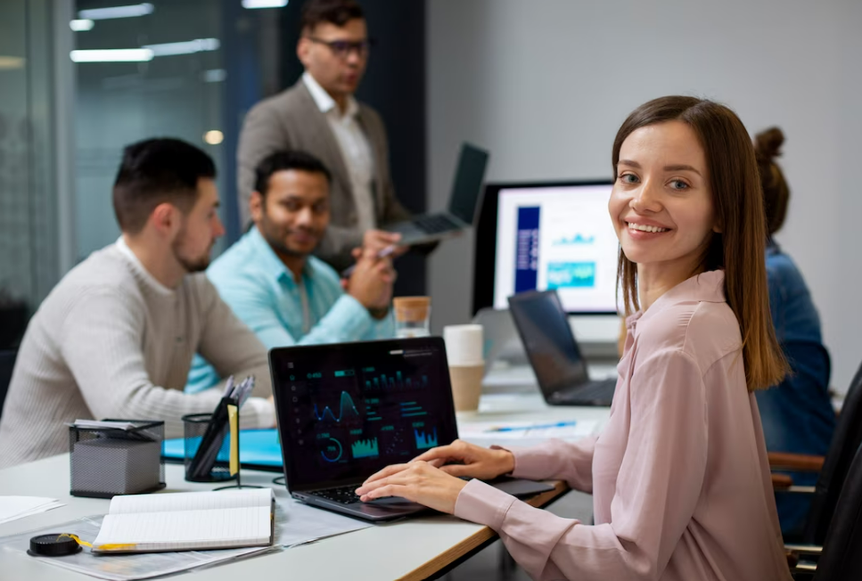 Several people sitting around using AI to perform a task.