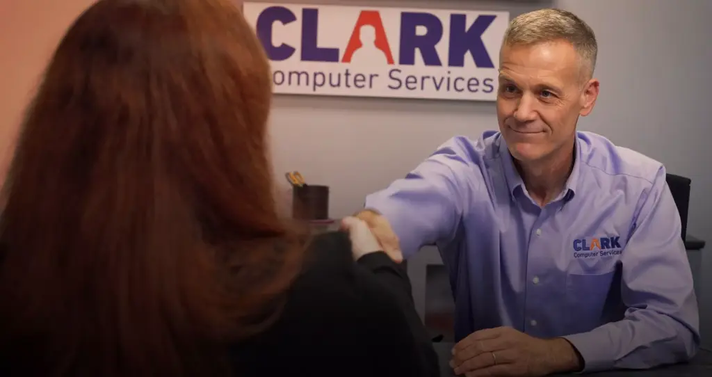 CLARK AI Managed Services Image of Darren Clark in a business meeting.